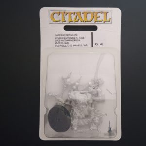 A photo of a 3rd edition Chaos Space Marines Lord Warhammer miniature blister