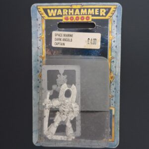 A photo of a 1st Edition Rogue Trader Space Marines Dark Angels Captain Warhammer miniature in blister
