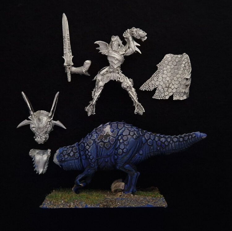 A photo of a Dark Elves Malus Darkblade on Cold One Warhammer miniature