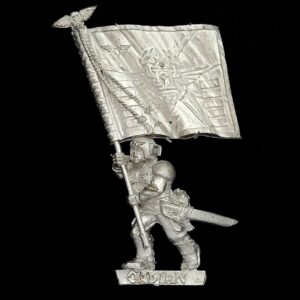 A photo of a 3rd editie Imperial Guard Cadian Command Standard Bearer Warhammer miniature