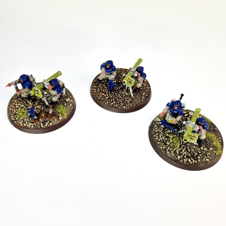 A photo of 3rd edition Imperial Guard Cadian Heavy Weapon Teams Warhammer miniatures