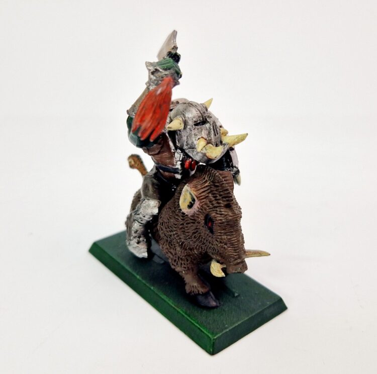 A photo of a Orcs and Goblins Orc Warboss on Boar Warhammer miniature