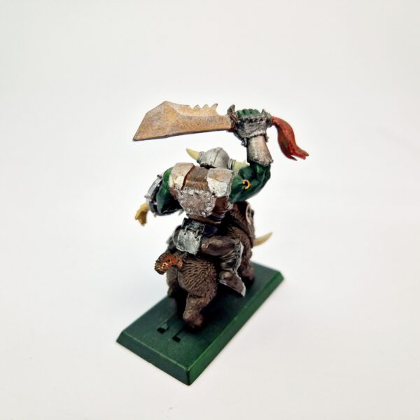A photo of a Orcs and Goblins Orc Warboss on Boar Warhammer miniature