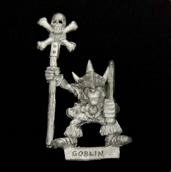A photo of a Orcs and Goblins Common Goblin Standard Bearer Warhammer miniature