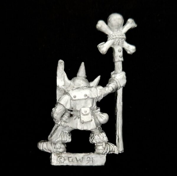A photo of a Orcs and Goblins Common Goblin Standard Bearer Warhammer miniature