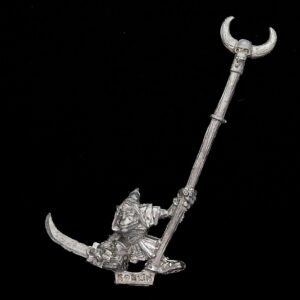 A photo of a Orcs and Goblins Night Goblin Standard Bearer Warhammer miniature