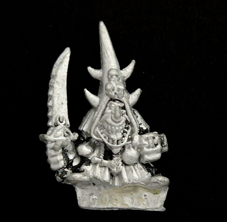 A photo of a Orcs and Goblins Night Goblin Champion Warhammer miniature