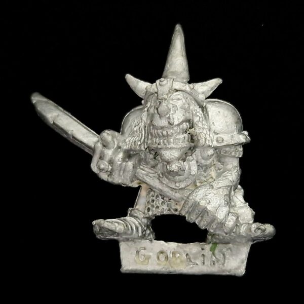 A photo of a Orcs and Goblins Night Goblin Champion Warhammer miniature