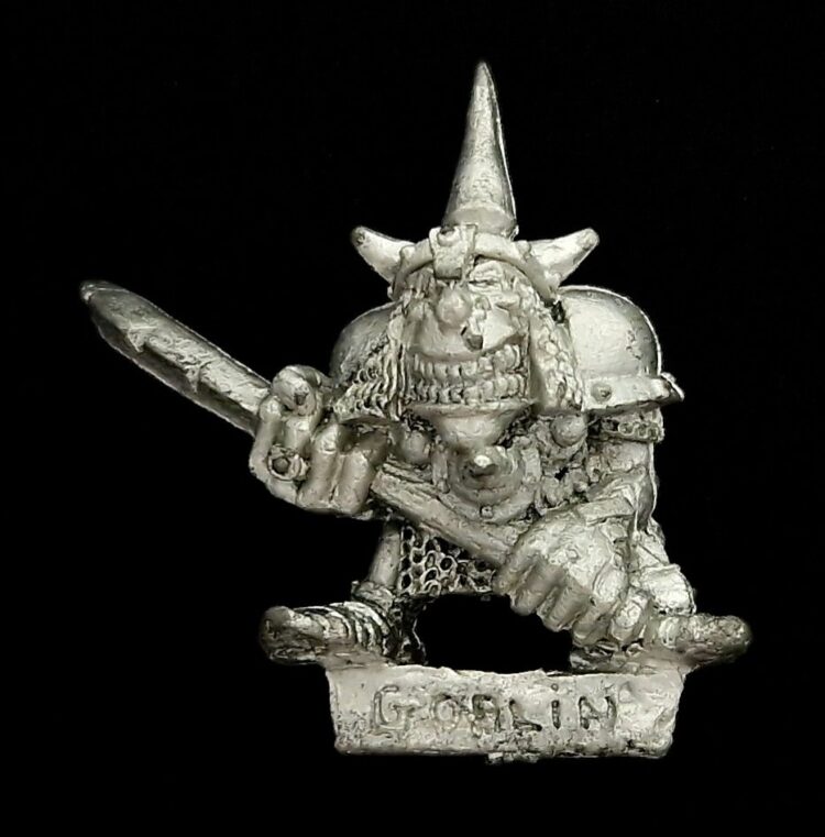 A photo of a Orcs and Goblins Night Goblin Champion Warhammer miniature