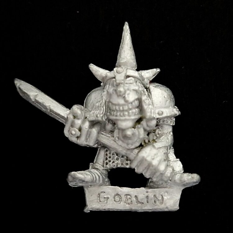 A photo of a Orcs and Goblins Night Goblin Champion Warhammer miniature