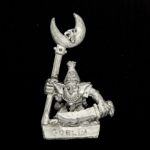 A photo of a Orcs and Goblins Night Goblin Standard Bearer Warhammer miniature