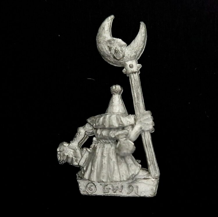 A photo of a Orcs and Goblins Night Goblin Standard Bearer Warhammer miniature