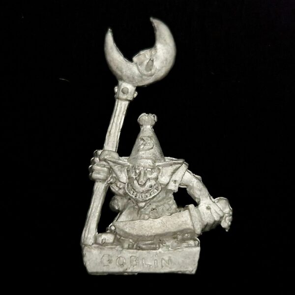 A photo of a Orcs and Goblins Night Goblin Standard Bearer Warhammer miniature