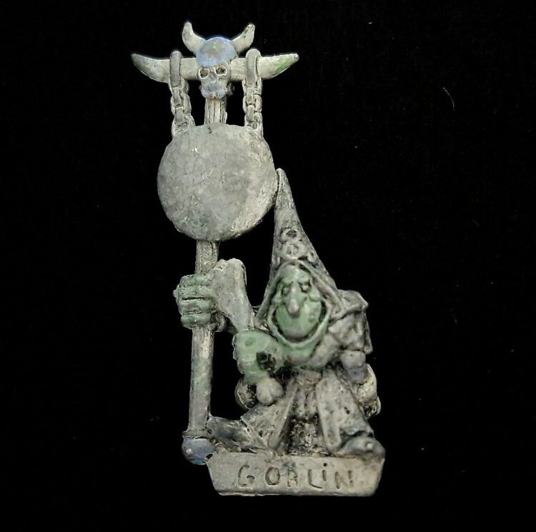 A photo of a Orcs and Goblins Night Goblin Musician Warhammer miniature