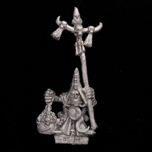 A photo of a Orcs and Goblins Night Goblin Shaman Warhammer miniature