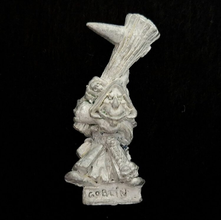 A photo of a Orcs and Goblins Night Goblin Clubber Warhammer miniature