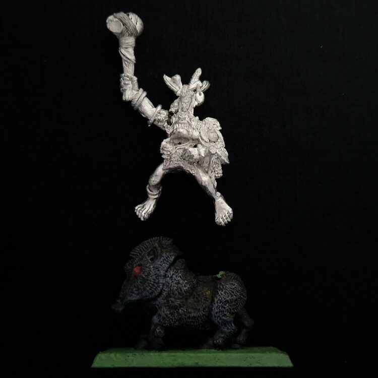 A photo of a Orcs and Goblins Savage Boar Boyz Champion Warhammer miniature