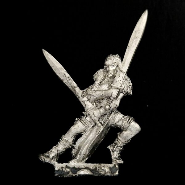 A photo of a Wood Elves Wardancer Warhammer miniature