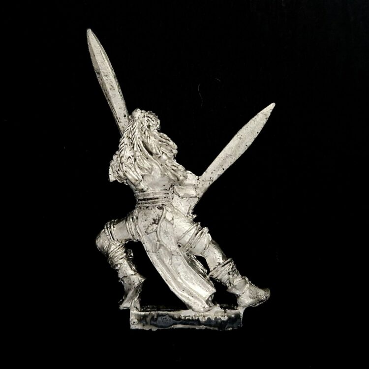 A photo of a Wood Elves Wardancer Warhammer miniature