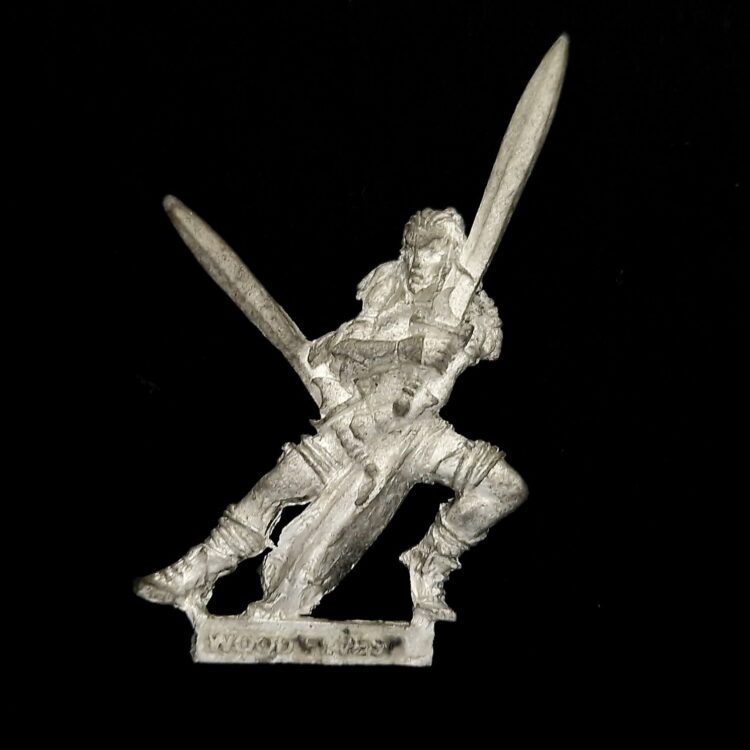 A photo of a Wood Elves Wardancer Warhammer miniature