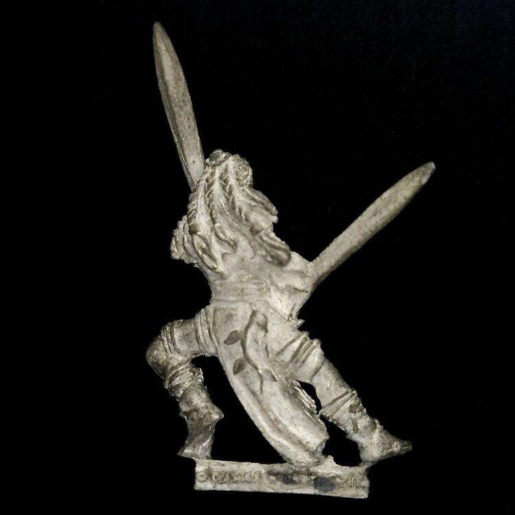 A photo of a Wood Elves Wardancer Warhammer miniature