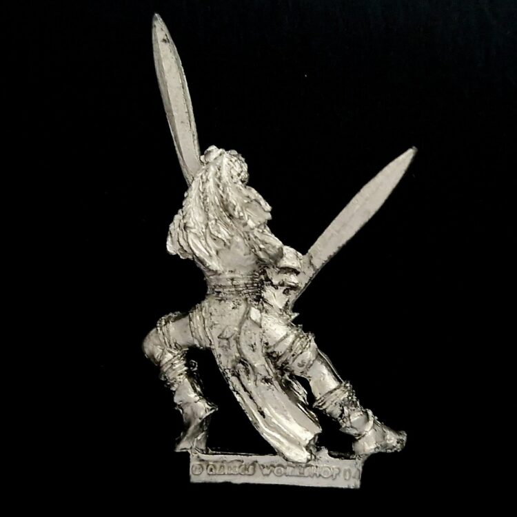 A photo of a Wood Elves Wardancer Warhammer miniature