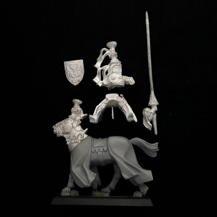 A photo of a Bretonnia Grail Knight Warhammer miniature