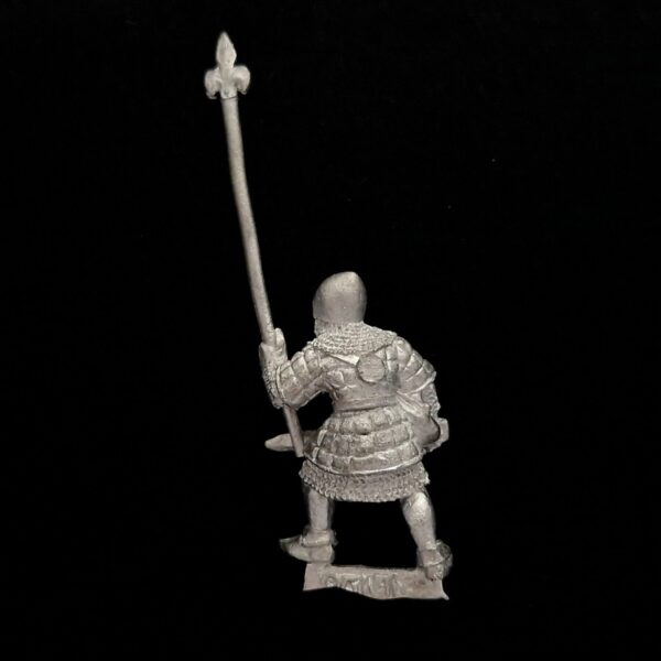 A photo of a Bretonnia Men at Arms Halbediers Standard Bearer Warhammer miniature