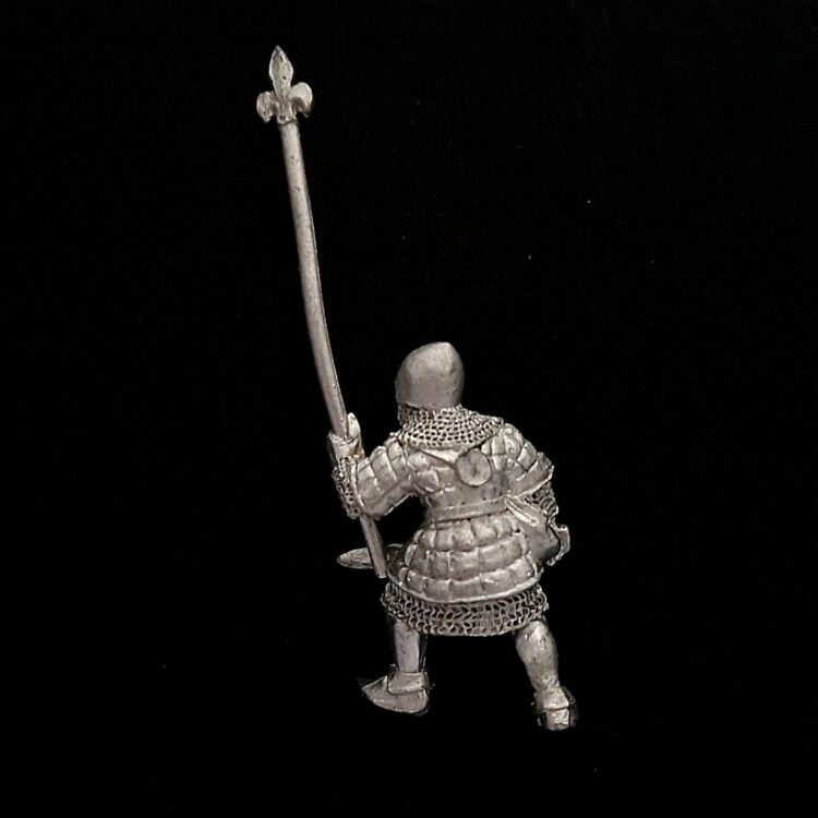 A photo of a Bretonnia Men at Arms Halbediers Standard Bearer Warhammer miniature