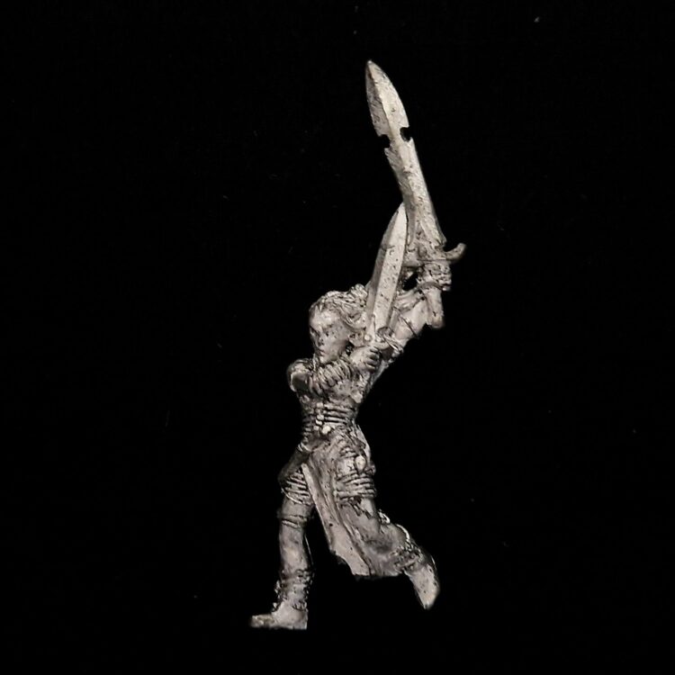 A photo of a Wood Elves Wardancer Warhammer miniature