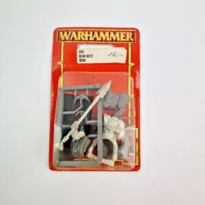 A photo of a Orcs and Goblins Orc Boar Boyz Boss Warhammer miniature