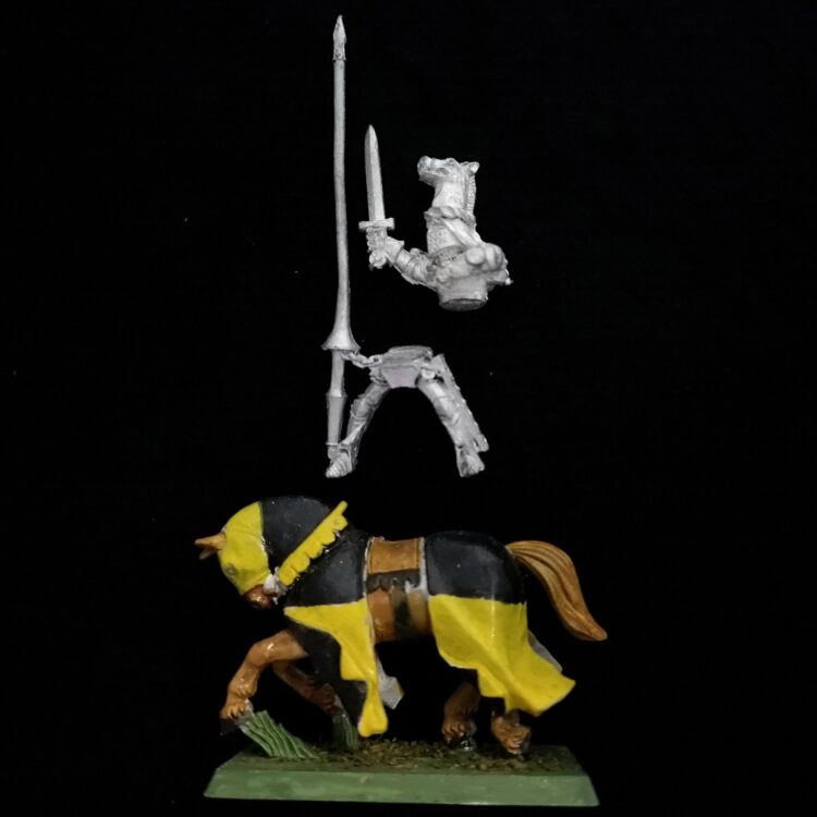 A photo of a Bretonnia Knight of the Realm Champion Warhammer miniature