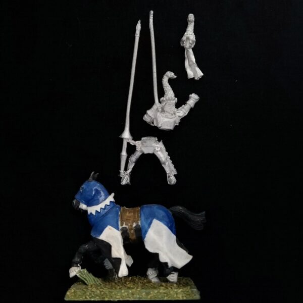 A photo of a Bretonnia Knight of the Realm Standard Bearer Warhammer miniature