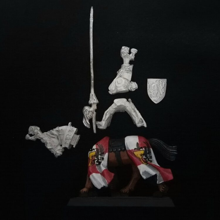 A photo of a Bretonnia Grail Knight Warhammer miniature