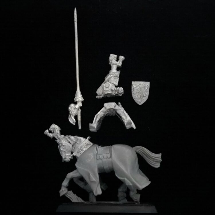 A photo of a Bretonnia Grail Knight Warhammer miniature