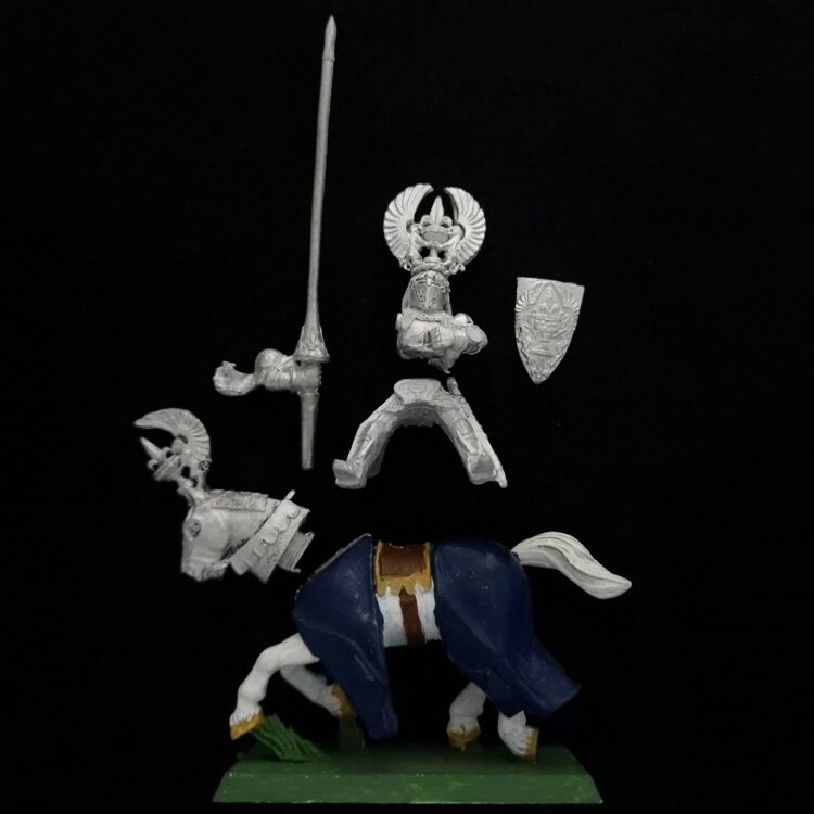 A photo of a Bretonnia Grail Knight Warhammer miniature