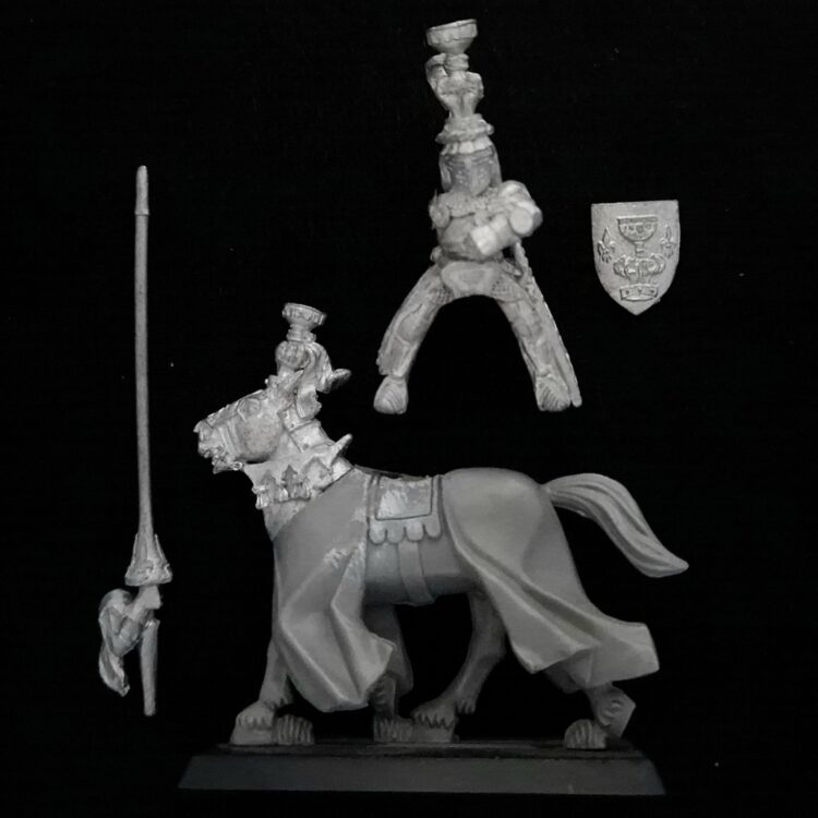 A photo of a Bretonnia Grail Knight Warhammer miniature