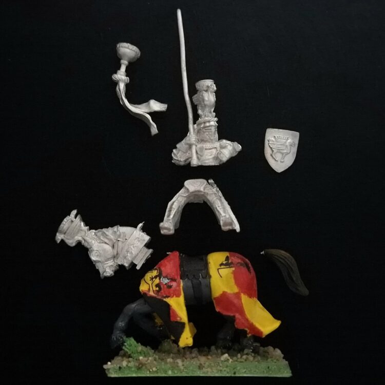 A photo of a Bretonnia Grail Knight Standard Bearer Warhammer miniature