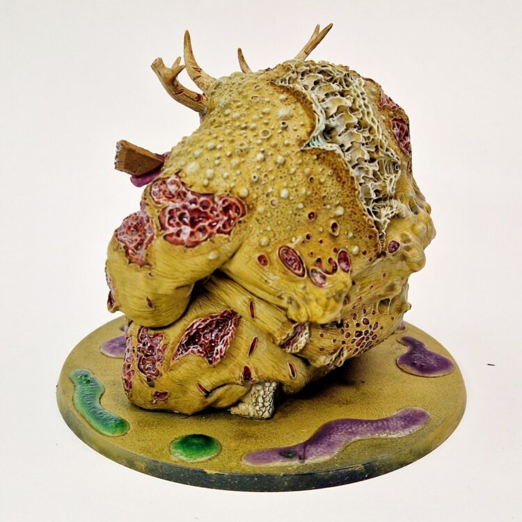 A photo of a Scabeiathrax Exalted Greater Daemon of Nurgle Warhammer miniature