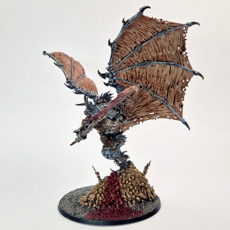 A photo of a Chaos Daemons Bloodthirster of Khorne Warhammer miniature