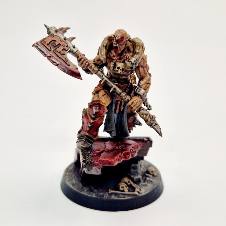 A photo of a Chaos Blades of Khorne Slaughterpriest Warhammer miniature