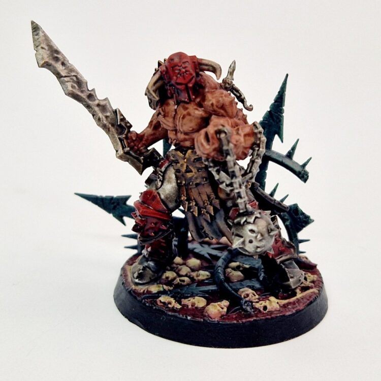 A photo of a Chaos Blades of Khorne Slaughterpriest Warhammer miniature