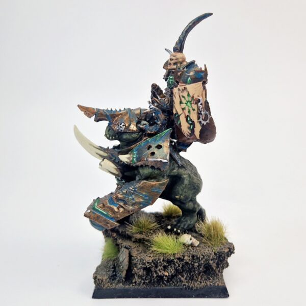 A photo of a Warriors of Chaos Lord on Gorebeast Warhammer miniature