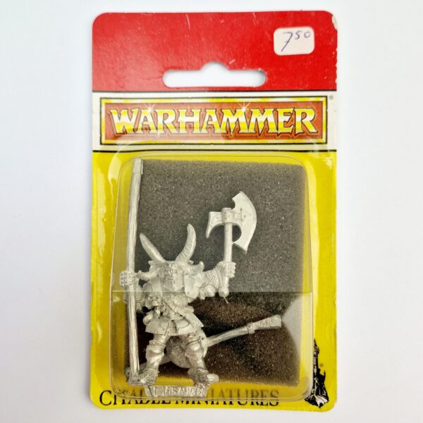 A photo of a Chaos Warriors Standard Bearer Warhammer miniature