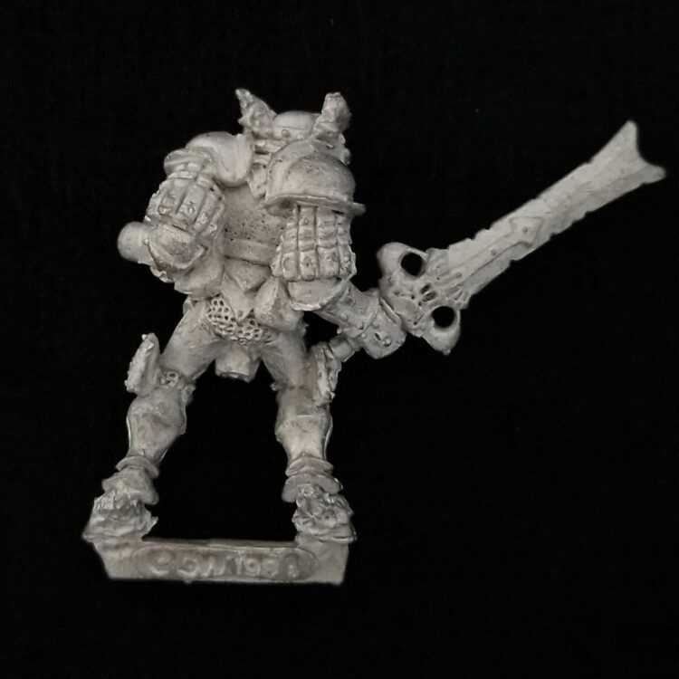 A photo of a Chaos Warriors Champion of Khorne Warhammer miniature