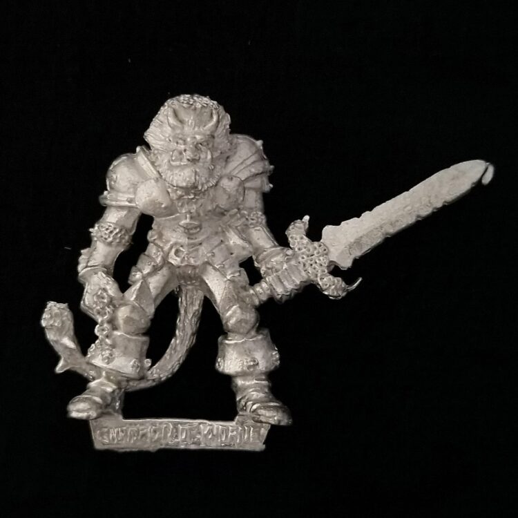 A photo of a Chaos Warriors Champion of Khorne Warhammer miniature