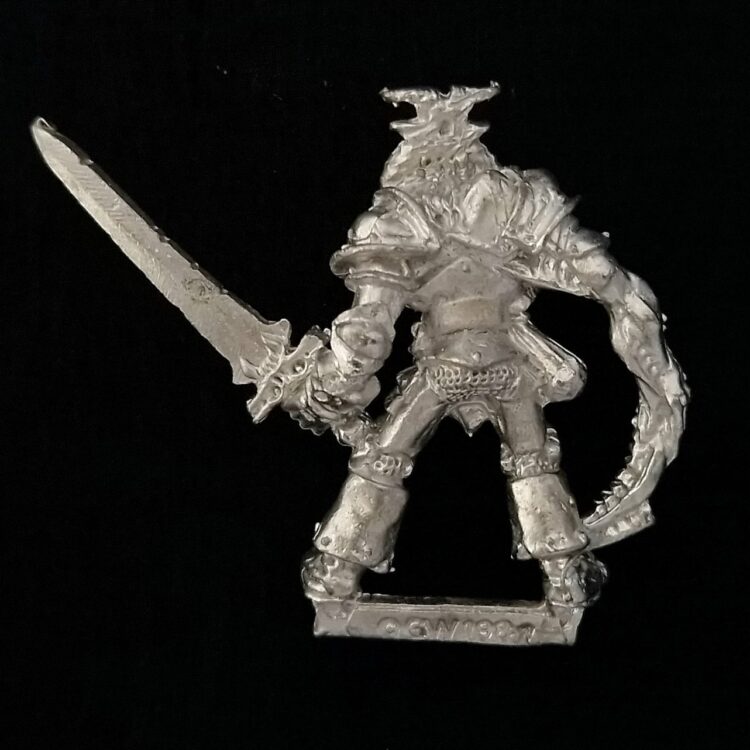 A photo of a Chaos Warriors Champion of Khorne Warhammer miniature