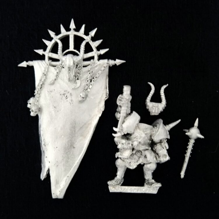 A photo of a Chaos Warriors Limited Edition Army Standard Bearer Warhammer miniature