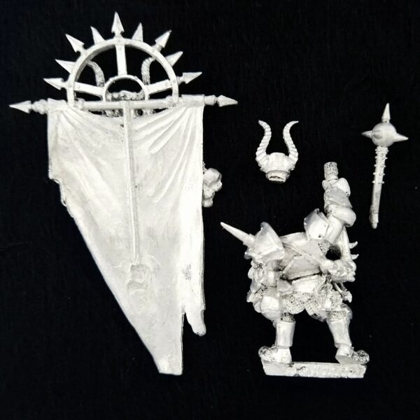 A photo of a Chaos Warriors Limited Edition Army Standard Bearer Warhammer miniature