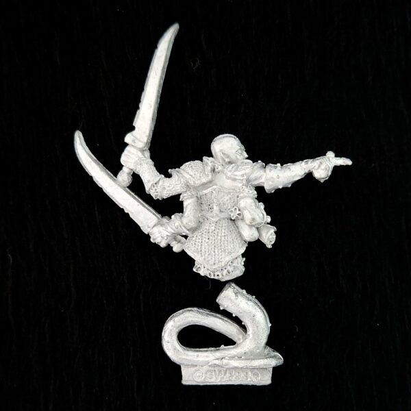 A photo of a Chaos Warriors Champion of Slaanesh Warhammer miniature